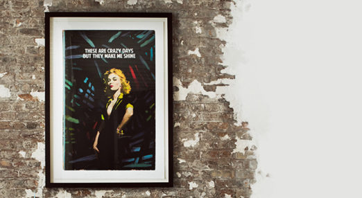 Photo or artwork by the Connor Brother mounted on brick wall