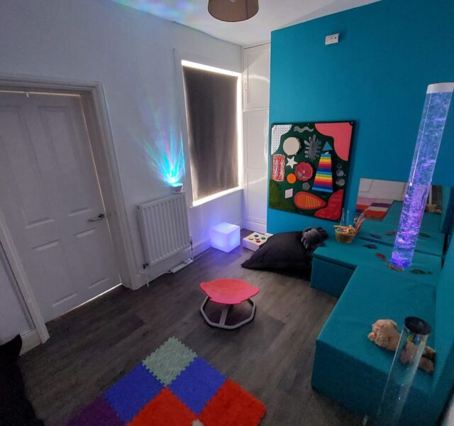 A sensory room in a refuge, with children's drawings, games and fidget toys