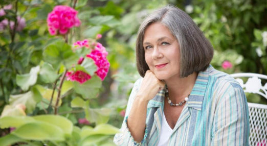 Sandra Horley sitting in Garden