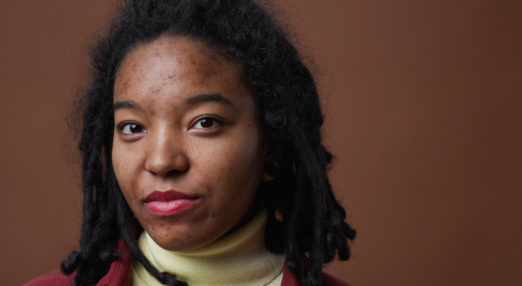Image of a young woman looking directly into camera