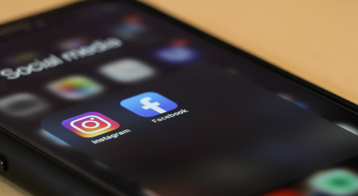 A smart phone showing the Facebook and Instagram icons
